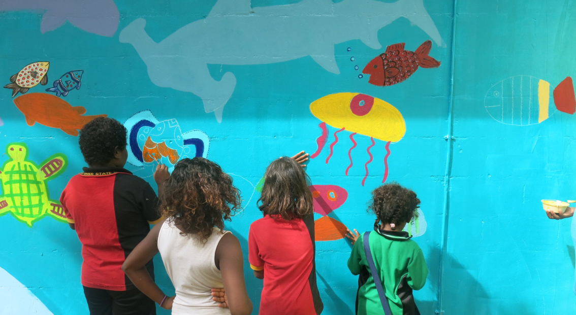 kids painting a mural